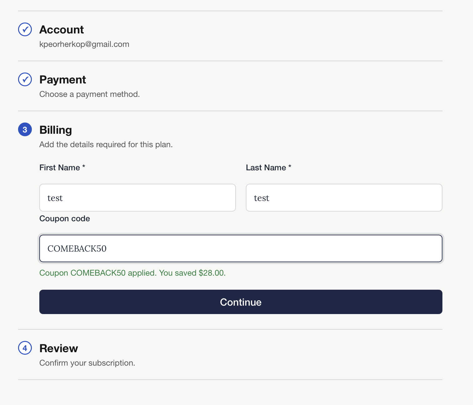 The Billing step of checkout with the coupon COMEBACK50 entered and a confirmation that says You saved $28.00